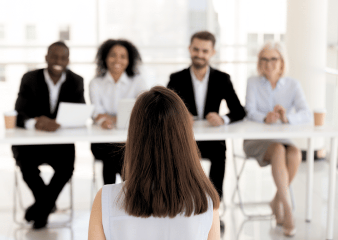 Candidate facing a diverse panel of interviewers during a job interview.