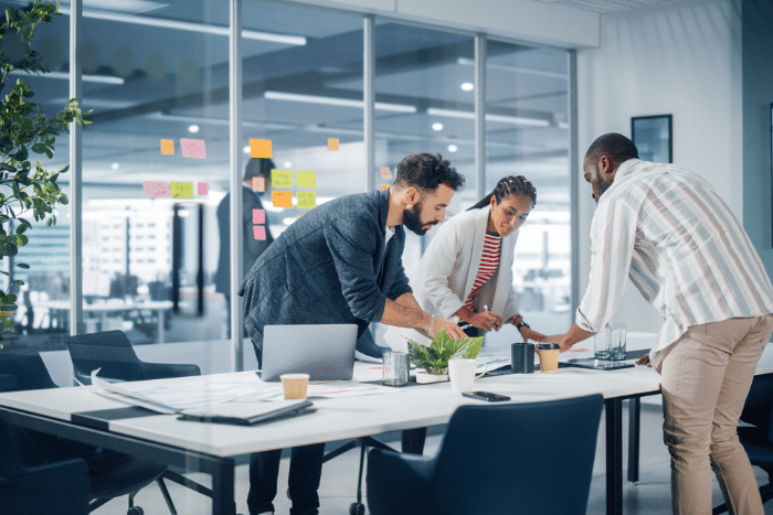 Diverse Team of Professional Businesspeople Meeting in the Office Conference Room.