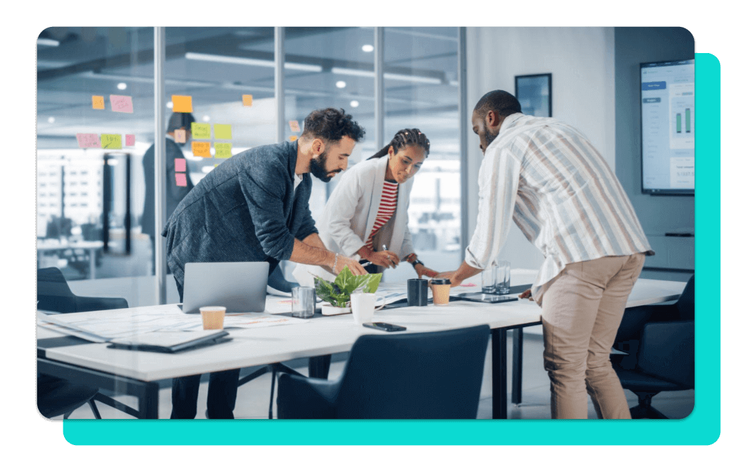 Diverse creative team of agency professionals working around a table.